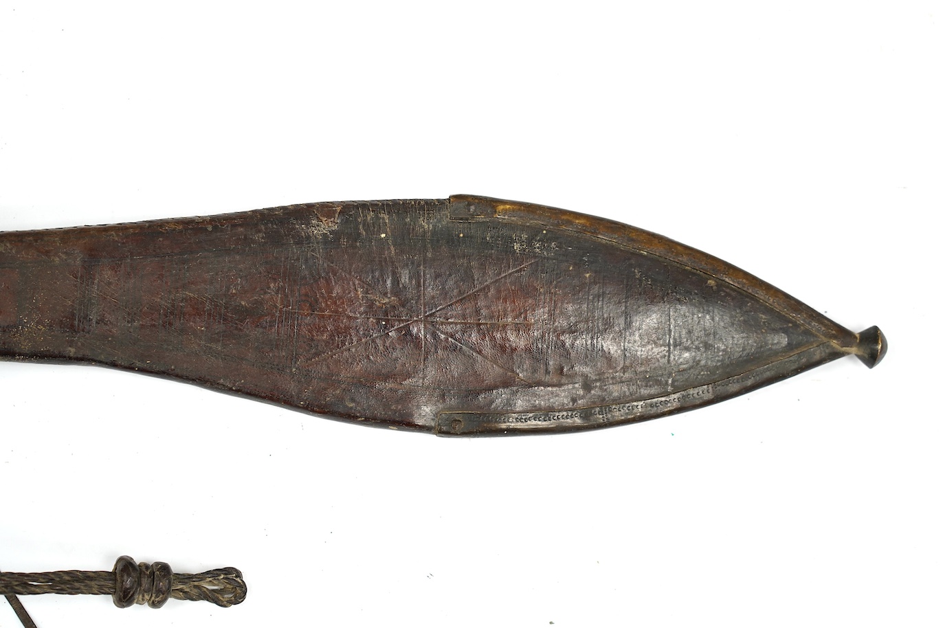 A late 19th century Nigerian Taboura from the Hausa People of Northern Nigeria, in leather scabbard, blade 55.5cm. Condition - good